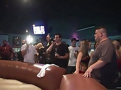 Horny bitches riding the raging bull at the party in thongs
