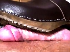 Dominating lady punishing a cock and balls with her shoes