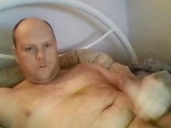 Handsome bald daddy shooting on face