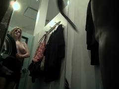 Voyeur spies on a stacked blonde teen in the dressing room