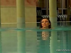 Gorgeous brunette goes for swim then gets her asshole and cunt fucked poolside