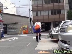Asian pisses in public on the street