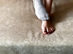Gloria Gimson strokes her sexy feet in gray socks