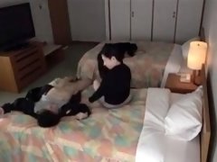 Busty Japanese milf gets drilled by a young guy on the bed