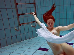 Redhead with big tits Lola underwater naked